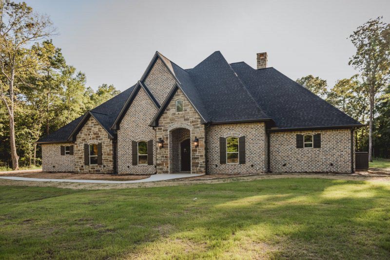 Custom French Country Home Brick with Stone Accents and Dormer