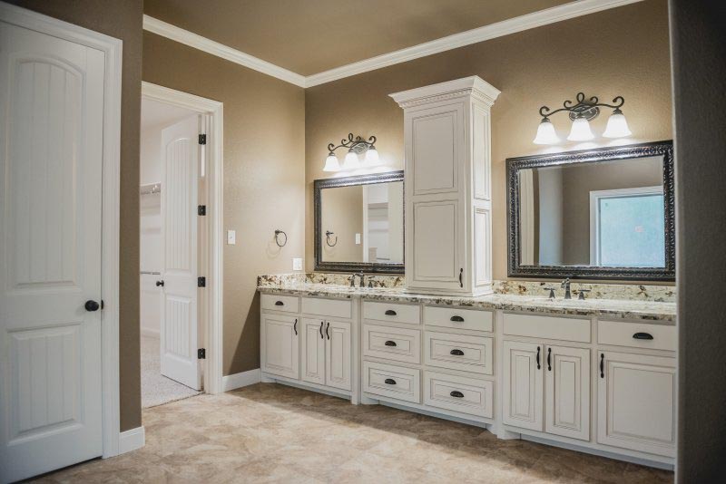 Master Bath Vanity with Custom Cabinets Granite Counters Oil Rubbed Bronze Fixtures and Hanging Mirrors